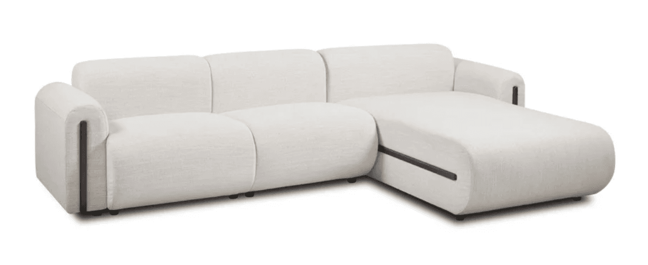 A cream sectional sofa from the store catalog on a plain background